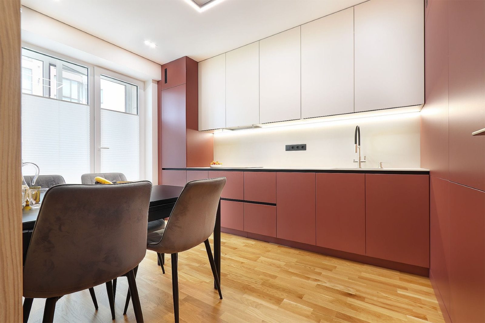 Kitchen along the wall, seen from the dining table