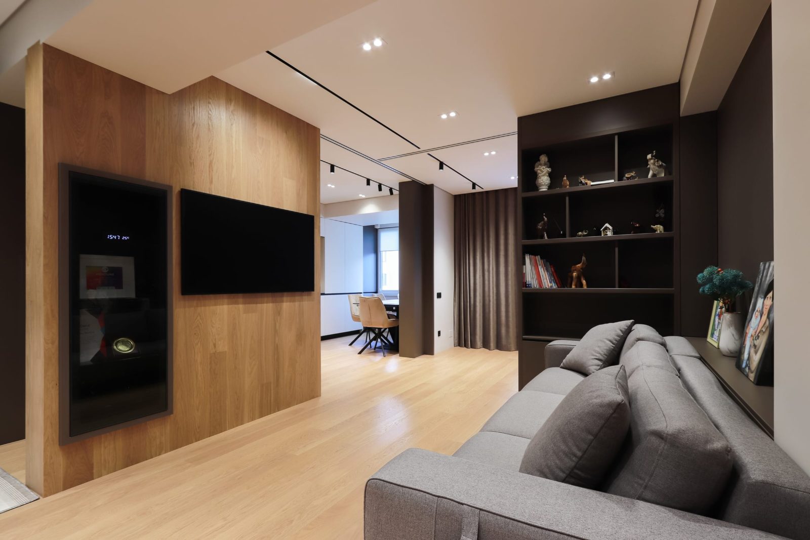 Oak wall and shelving, with the dining area beyond