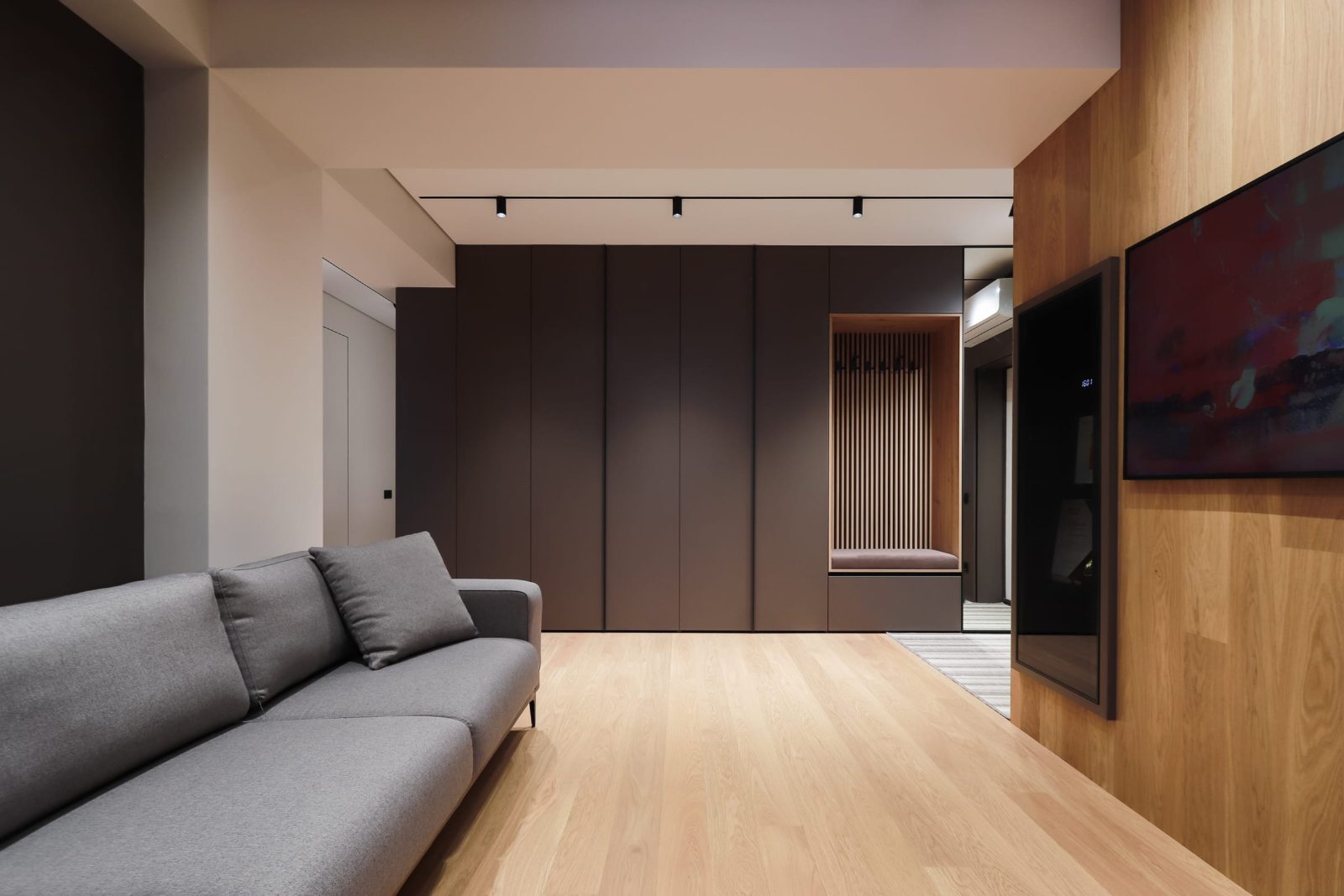 Living area against the dark panelled wall