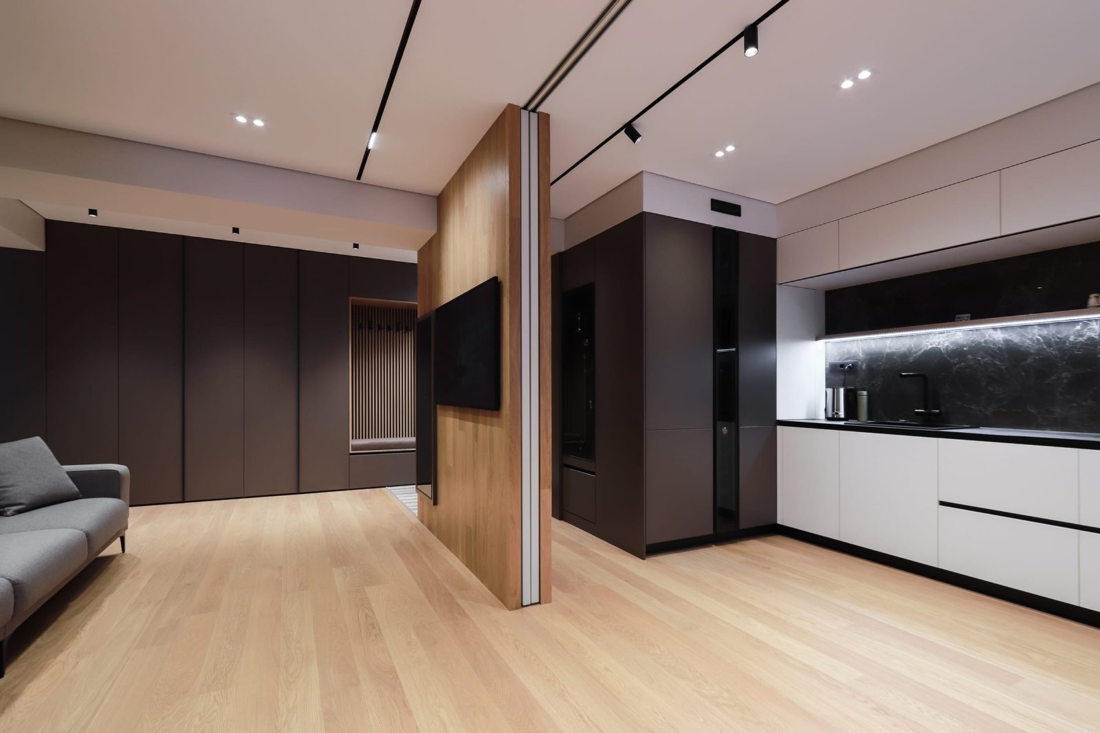Kitchen seen past the oak partition