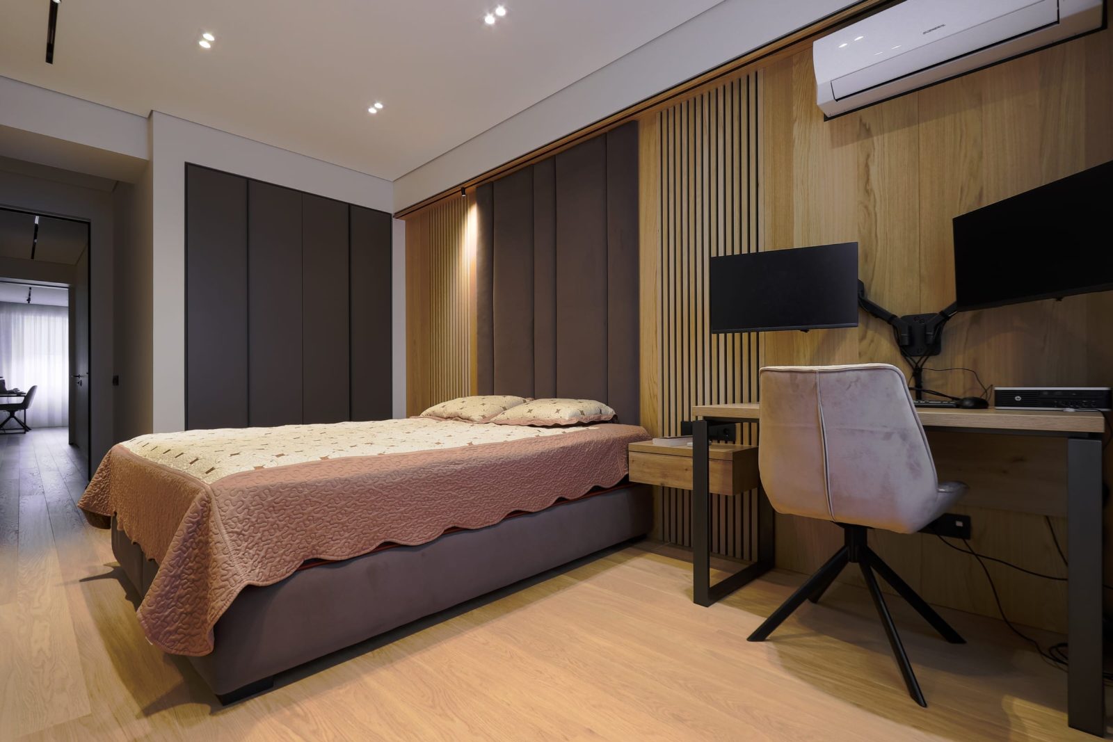 Bedroom with built-in desk and wall panelling