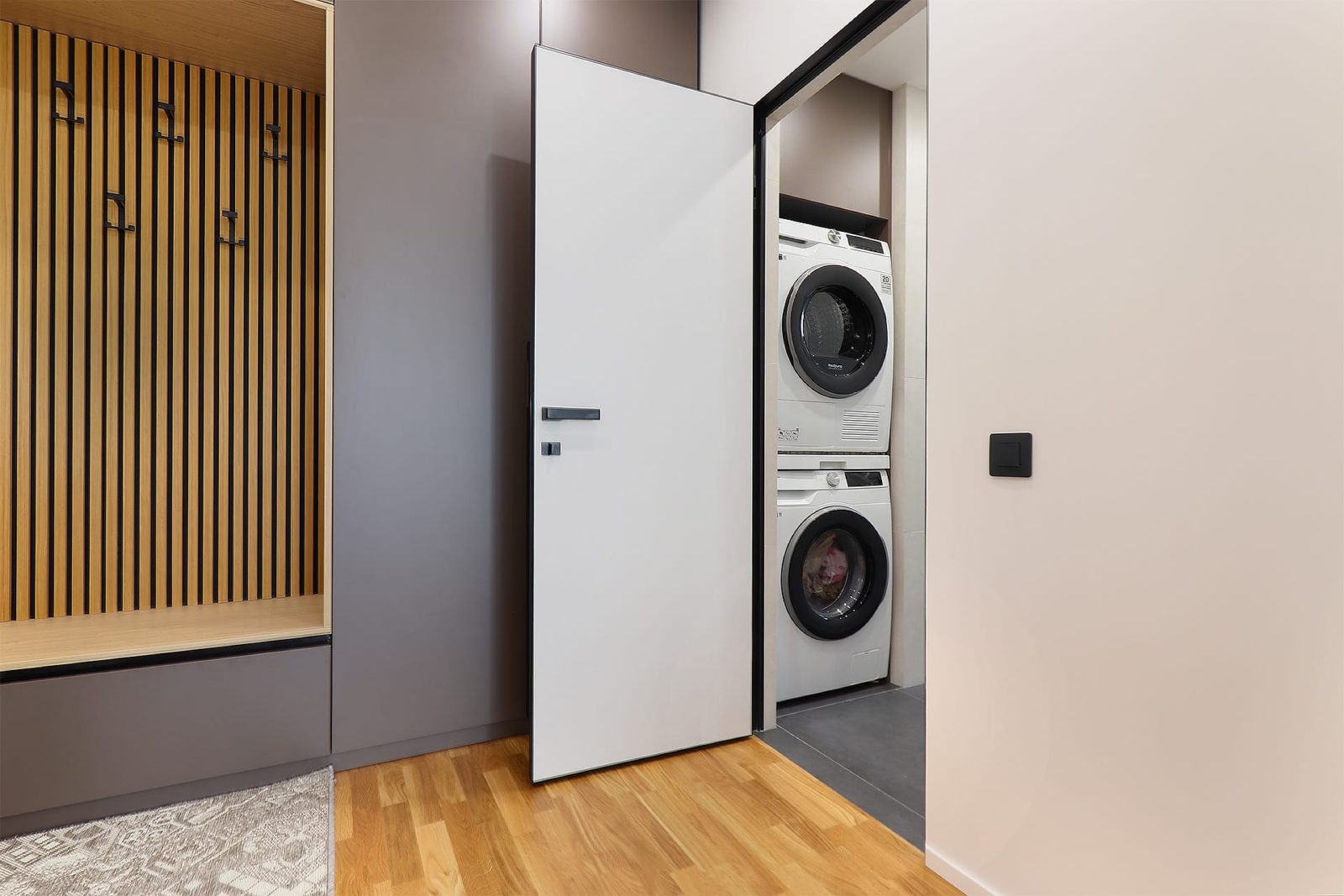 Laundry niche beside the coat rack